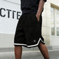 Pantaloncini sportivi con coulisse in vita e orlo a righe