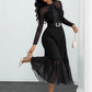 Elegante abito midi a pois con collo annodato