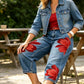 Jeans da donna a gamba larga con stampa floreale artistica.