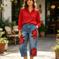 Jeans da donna a gamba larga con stampa floreale artistica.