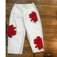 Jeans da donna a gamba larga con stampa floreale artistica.