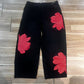 Jeans da donna a gamba larga con stampa floreale artistica.