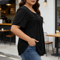 T-shirt da donna con maniche a sbuffo e pieghe sul davanti