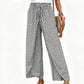 Pantaloni da donna a gamba larga con spacco e vita arricciata