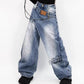 Jeans in denim a gamba larga con vita asimmetrica da donna