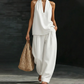 Completo casual da donna con top allacciato al collo e pantaloni a gamba larga
